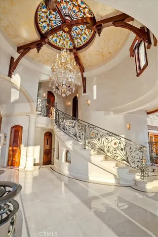 18-foot ceilings, mahogany corbels, and stained-glass skylight can be found in the Foyer