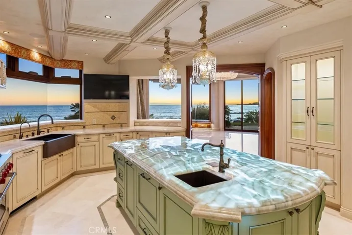 Chef's kitchen with backlit onyx island