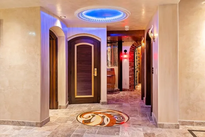 Entry to the downstairs powder bath & wine cellar or elevator