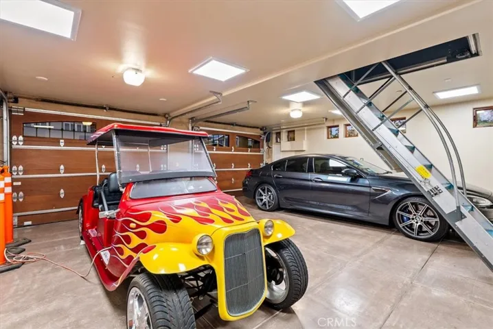 Detached 2 Car Garage with motorized staircase to the bonus room above.