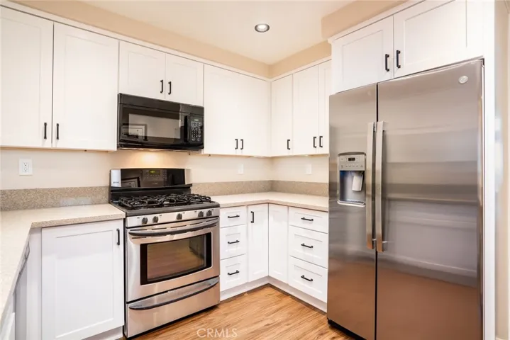 Newer Cabinets, Granite Counter Tops, 5-Burner Stove