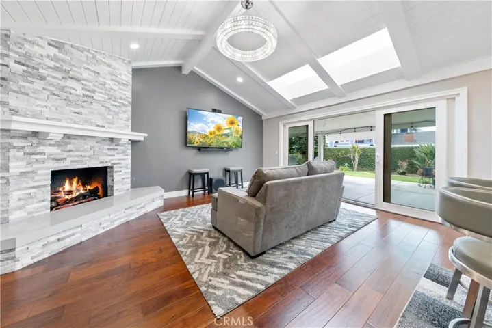 This Floor to Ceiling Fireplace w/Soft Grey-Stone Hearth & Lg Mantel is the Family/Dining Room Focal Point