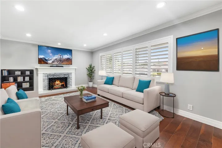 We wanted to give you an idea of how different patterns & colorful styles can transform the look in your new living room.  The Plantation Shutters & Wood Burning Fireplace are Real... The Art, Rug, Furniture & bookcase are Virtual-Staging to offer you just 1of 100's of possible design ideas.  Who will the designer in your home be?