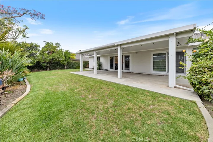 Had to step out again - See the Zebra Shades on Right ~ Family Room at Center ~ Kitchen Window on far left ~ All overlooking the Neatly trimmed Backyard Lawn, bordered w/a mix of fruit trees and choice foliage.
