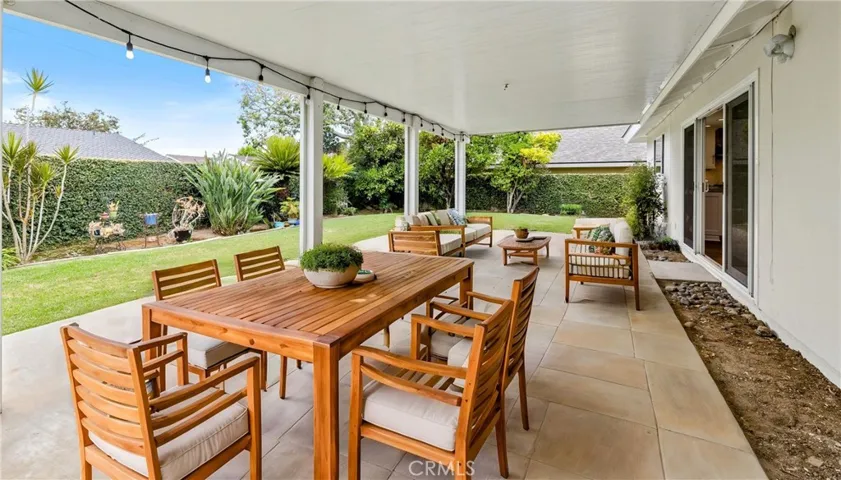 Take it outside!! Expand your living area outdoors for added dimension to entertaining friends and family.  The Virtual concrete staining & teak-wood furniture are but 1of dozens of options for this covered patio