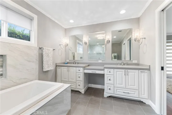 Look, there are Bathrooms & Master Bathrooms BUT THEN there are actual ROOMS that are Skillfully, Masterfully Redesigned into Luxurious Bathrooms! Starting w/a Vanity Top between Dual Sinks & Lighting Galore
