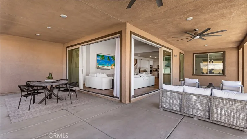Wrap-around covered patio, enhancing the indoor-outdoor living experience.