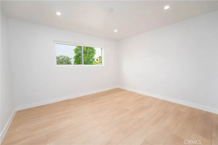 Bedroom #3 with walk in closet upstairs with views of backyard facing east