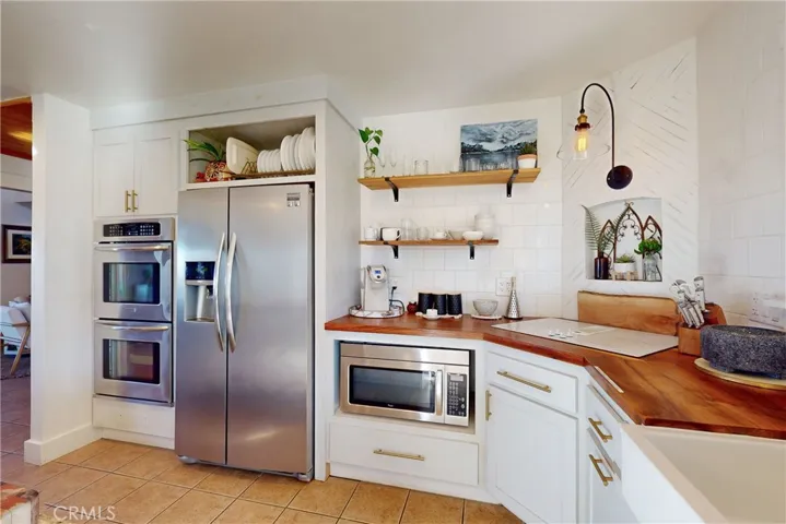 Stainless appliances and wood counter tops
