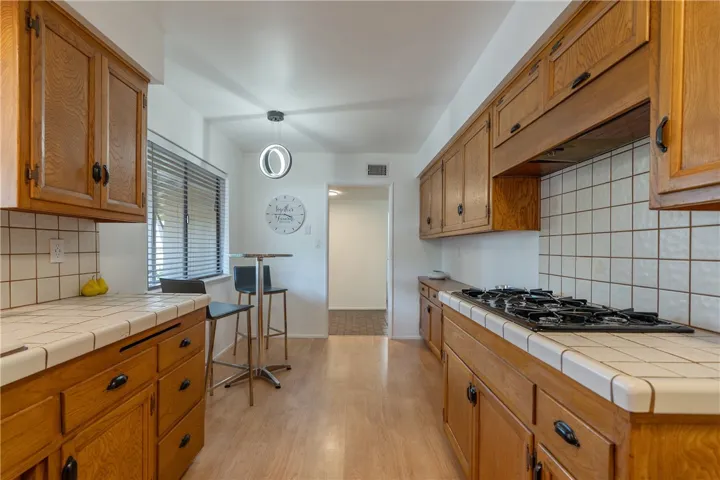 Large kitchen with ample storage and pantry.