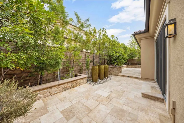 Outdoor artscape space with water fountains and fireplace.