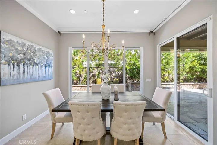 Formal dinning with outdoor view of water fountains.