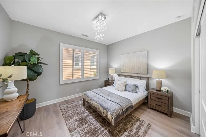 Spacious 4th bedroom with hardwood flooring