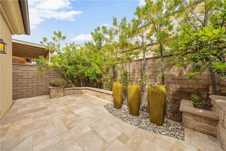 Outdoor artscape space with water fountains and fireplace.