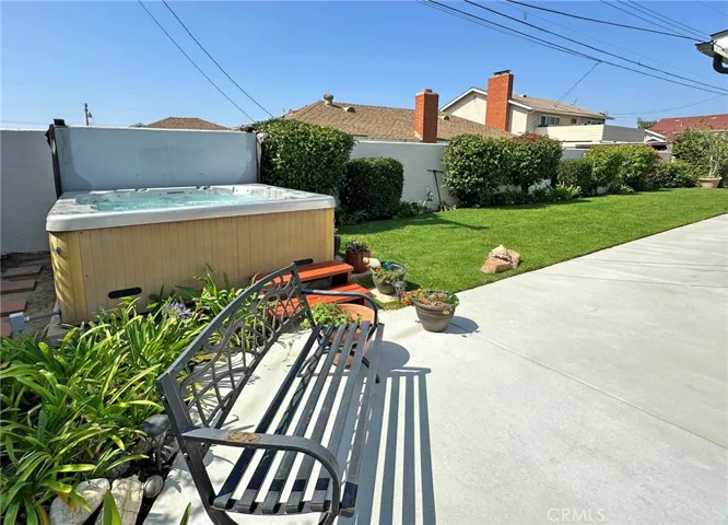 Six-person spa highlights private backyard that also includes fountain