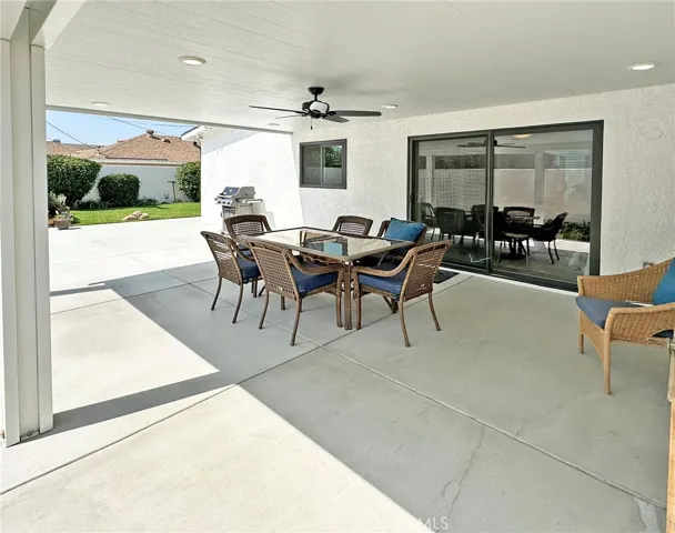 Large outdoor entertaining space has covered patio with LED lighting, ceiling fan, and plenty of room for all your celebrations.