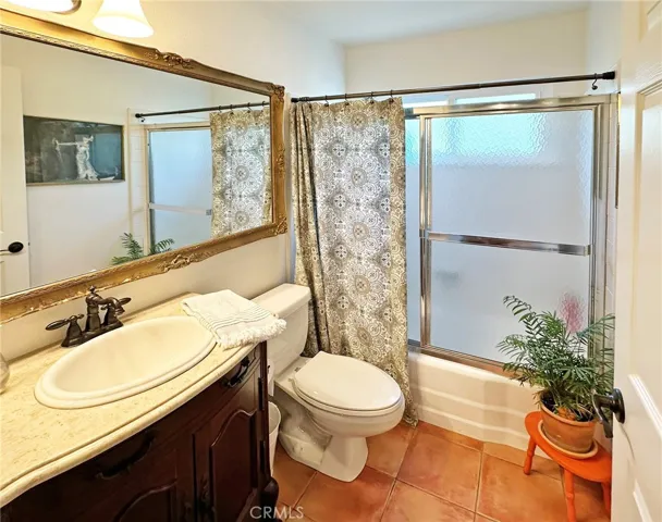 Elegant guest bathroom with full size bathtub/shower.