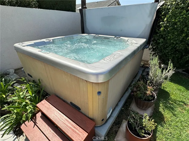 Backyard spa is extra roomy and provides extra relaxation in your private backyard.