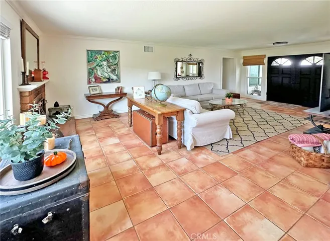 Livingroom has plenty of space for both entertaining and/or relaxing, ability to open double doors to covered front porch for ability to fully utilize indoor/outdoor space.