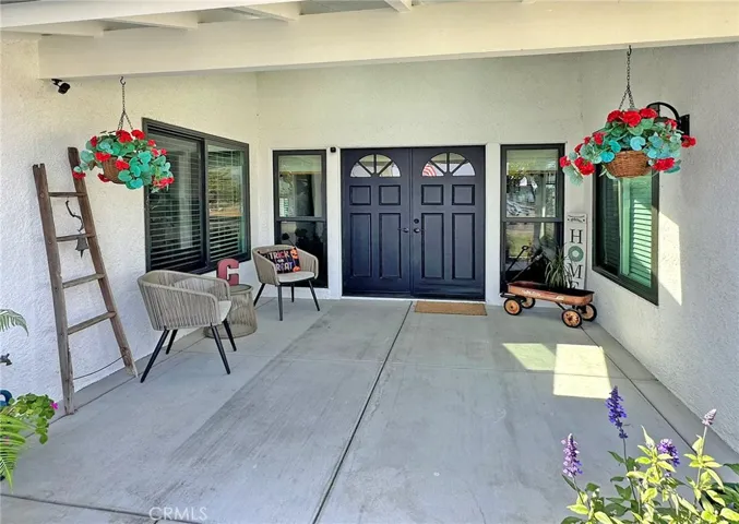 Welcoming covered front porch with skylights and automatic front light let you greet your guests in style and provides plenty of room for comfortable outdoor seating area.