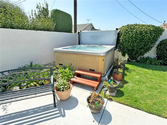 Large spa easily is accessible in private, beautifully maintained backyard setting.