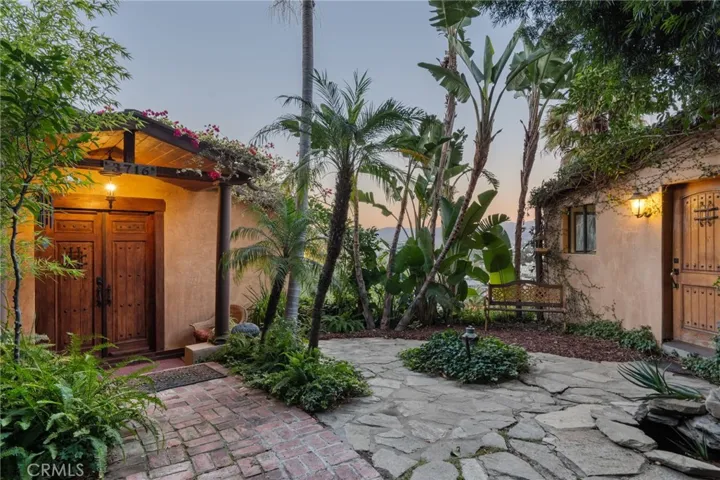 Welcome to 3716 Berry Dr with lush, secluded surroundings and gorgeous city & mountain views only minutes from Ventura Blvd