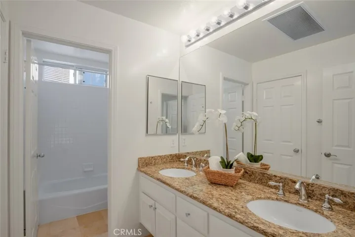 Spacious hall bathroom with double vanity