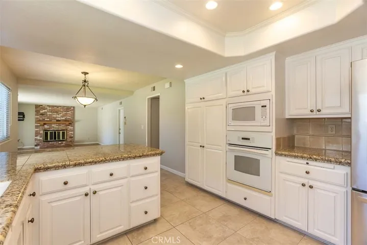 The kitchen opens to the nook and family room.