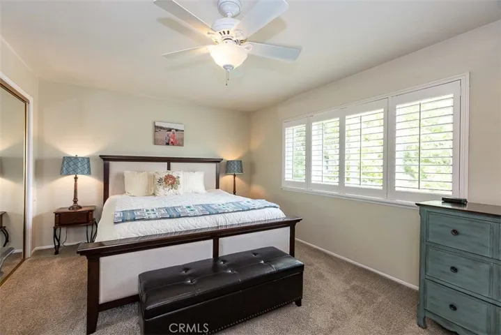 Primary bedroom with plantation shutters