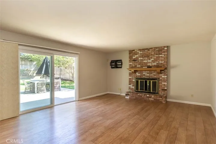 Large family room, with a wood burning fireplace.