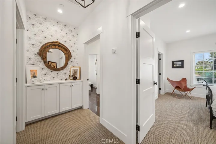 Hallway with linen cabinets