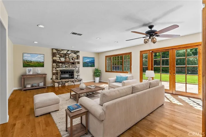 Second living space with dry bar and access to backyard