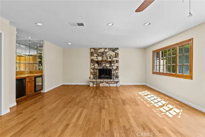 Second living space with dry bar and access to backyard