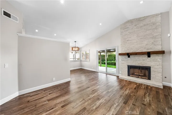 Living room w/ custom fireplace and mantle