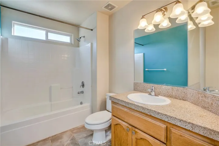 Full bath at the end of the hallway.