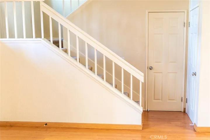 Powder room and stairs leading upstairs