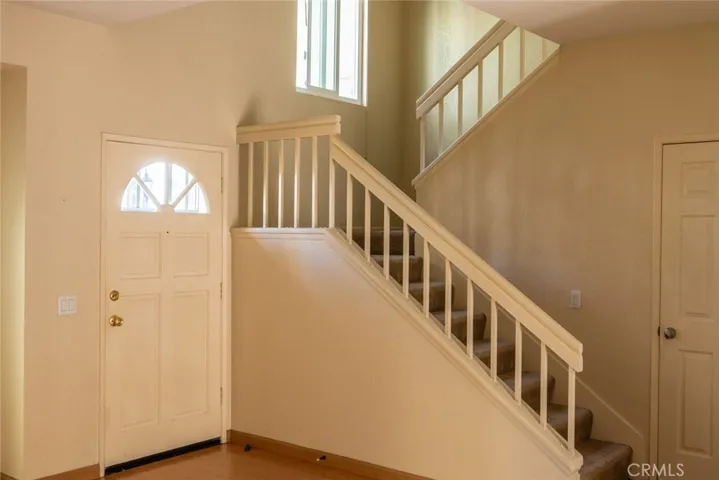 Stairs and front door. Very bright home!