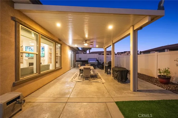 Patio with lights and ceiling fan