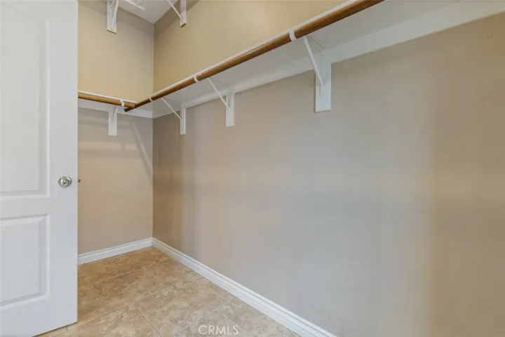 Walk-in closet just inside the primary bathroom.