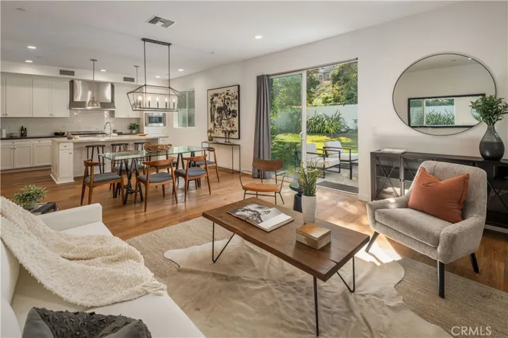 Living room with dining and kitchen view
