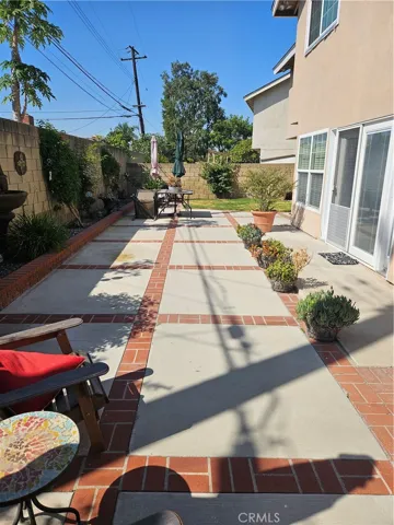 Large back yard with a patio area.