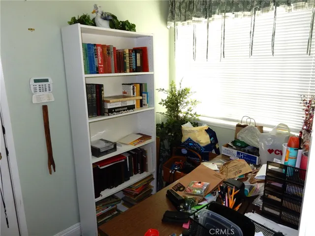Office area in the laundry room off of the garage and the family room. Laundry is to the left.