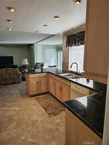 Kitchen leads to the family room.