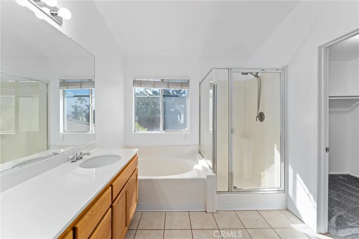 Primary Bathroom with walk-in closet