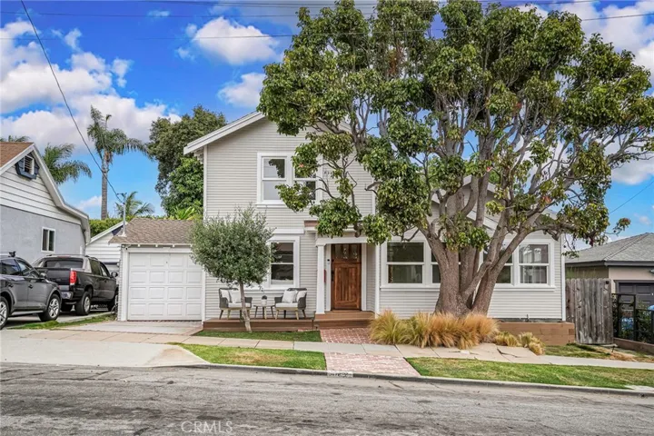 Originally built in 1910, this darling beach Craftsman has so much curb appeal.