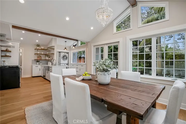 The French doors and windows invite light and nature inside.