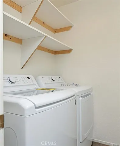 Indoor laundry room with newer full size Washer/Dryer