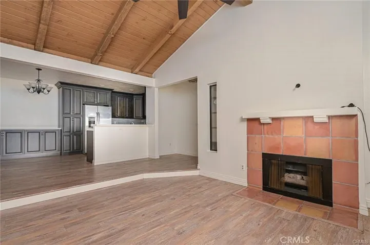 Vaulted Living room opens to Kitchen