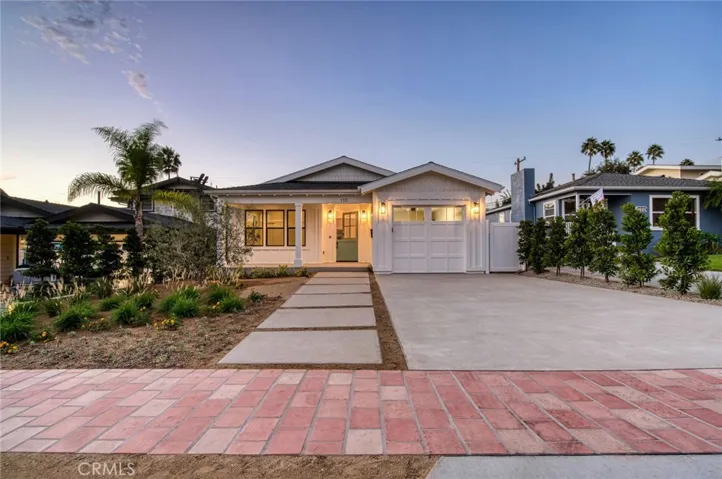 Older photo is representative of property, but updated photos showing mature landscaping coming