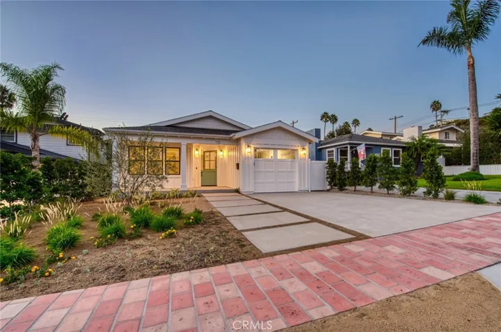 Older photo is representative of property, but updated photos showing mature landscaping coming